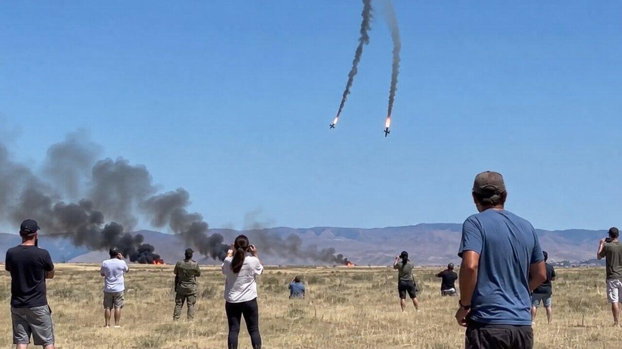 Spectators watch smoke rise after two F 18 fighter jets collided during an air show at Mountain Home Air Force Base in Idaho.