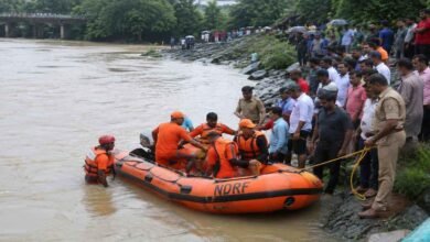 Rescue teams carrying out operations near a river in Karnataka after a tragic accident involving people swept away by rising water currents.