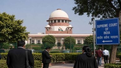 Supreme Court of India building with legal professionals and visitors outside during discussions on street dog safety and legal responsibility.
