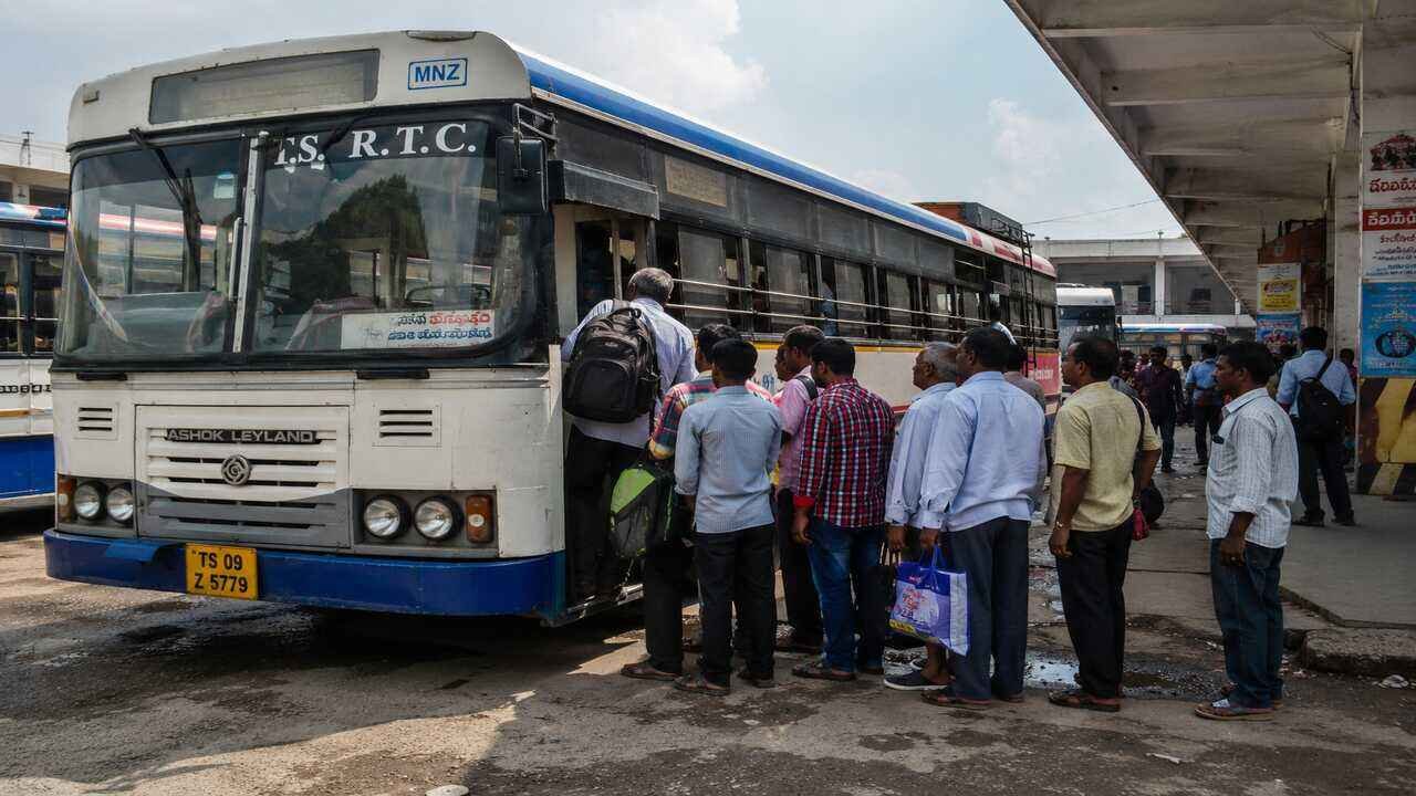 RTC passengers boarding a TGSRTC bus as the Telangana government moves ahead with plans to merge RTC employees into the state system