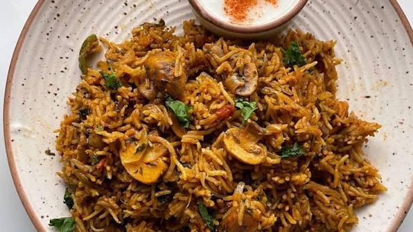 Chettinad Style Mushroom Biryani in Pressure Cooker Rich Spices Coconut Aroma and Perfect Fluffy Texture at Home