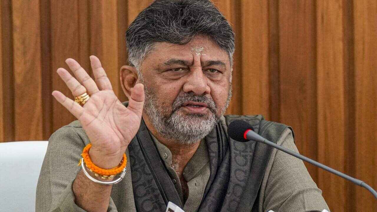 DK Shivakumar preparing to take oath as Karnataka Chief Minister during a high profile swearing in ceremony attended by senior Congress leaders, alliance representatives and dignitaries.