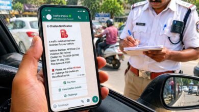 A motorist checking a traffic challan notification received on WhatsApp while traffic enforcement officials monitor violations under the new digital e challan system